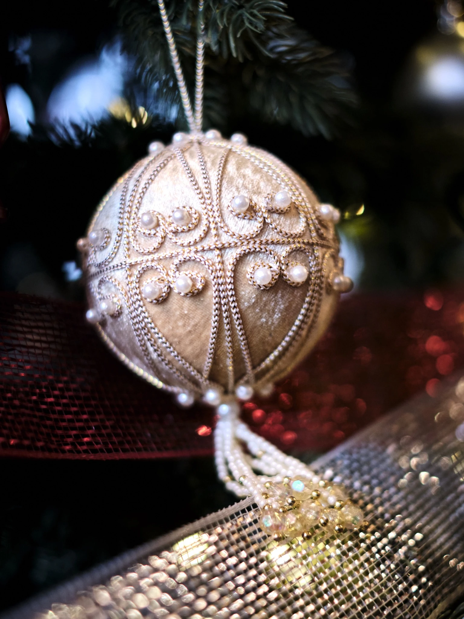 Heirloom pearl and gold Christmas ornament close-up