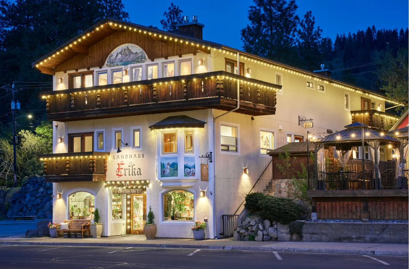Landhaus Erika exterior at blue hour with warm string lights