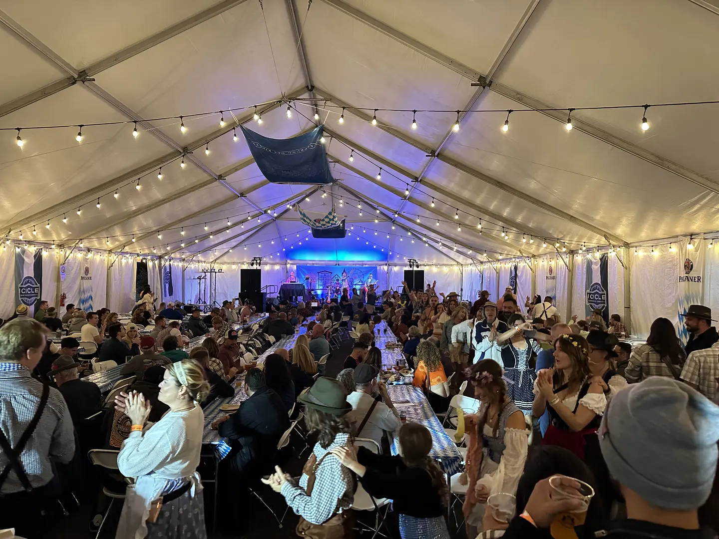 Inside the Bierzelt tent at night, packed crowd and stage lights