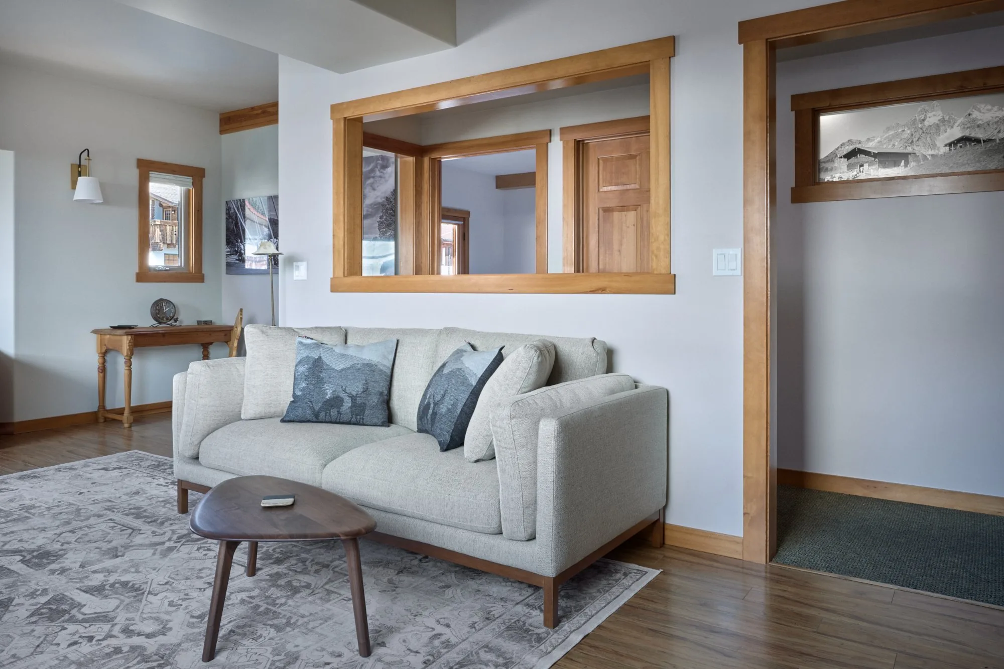 Solstice Suite living room sofa and pass-through window to bedroom