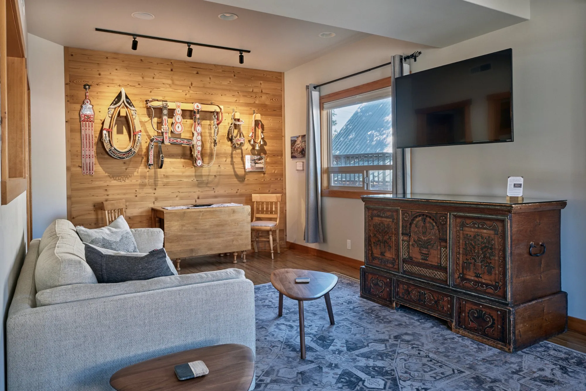Solstice Suite living room with 1742 Truhe and horse harness wall