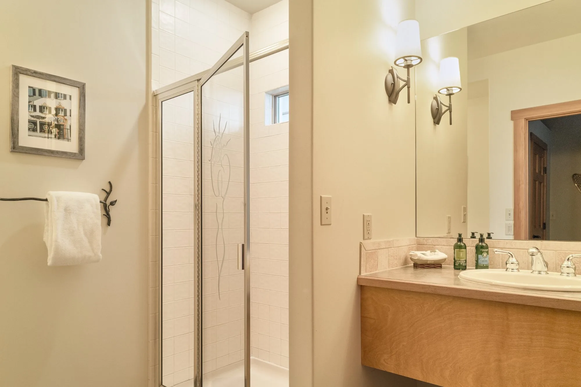 Winter Suite bathroom with etched glass shower and floating vanity