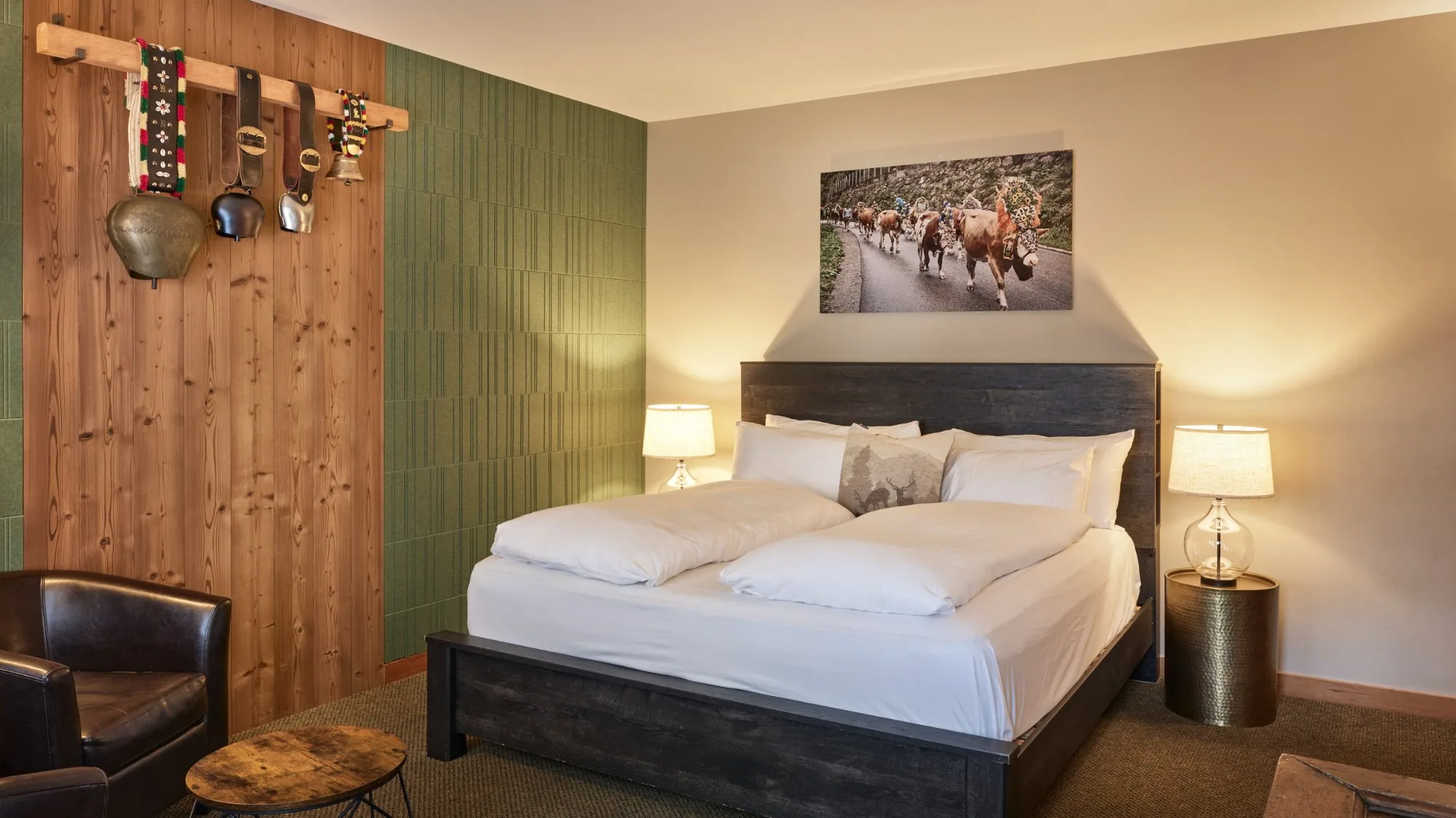 Winter Suite bedroom with cowbell wall display and almabtrieb canvas