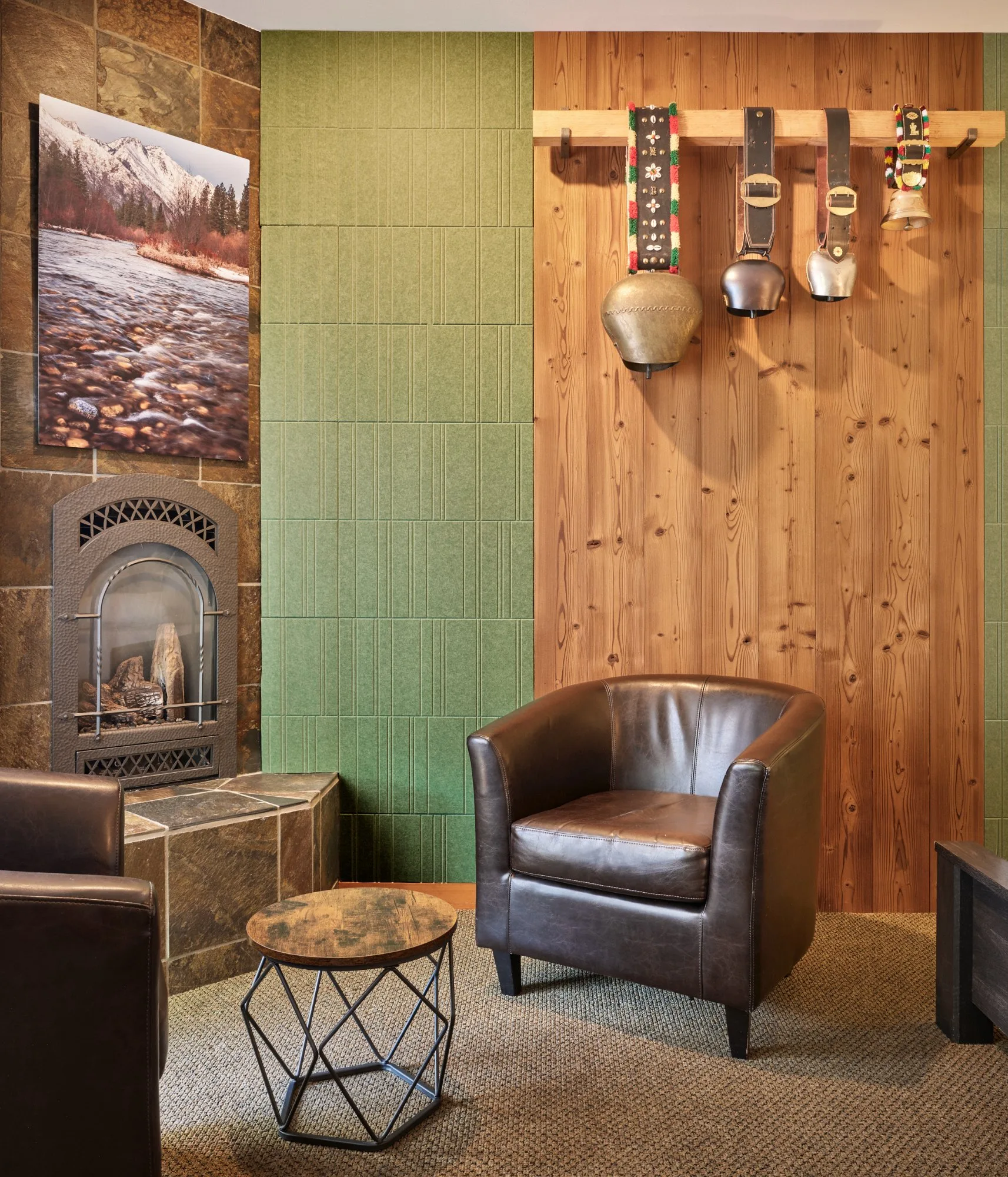 Winter Suite gas fireplace with leather armchair and cowbell wall