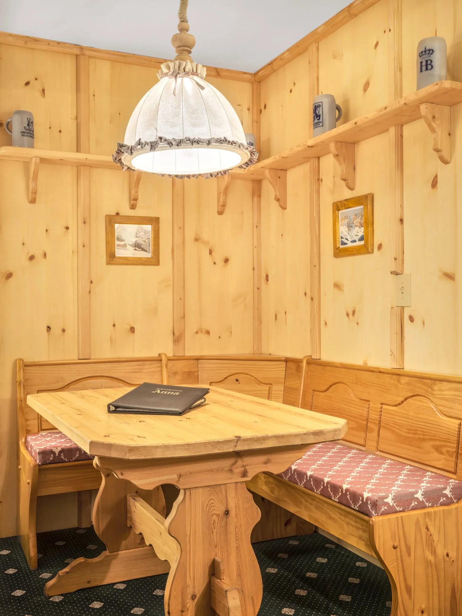 Brixental — pine stube nook with beer steins