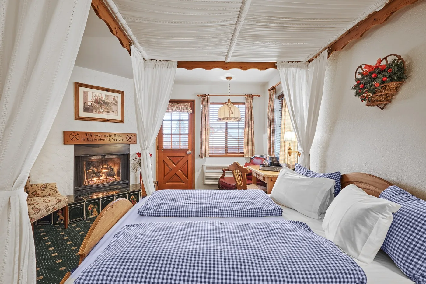 Herzog Suite canopy bed and lit fireplace